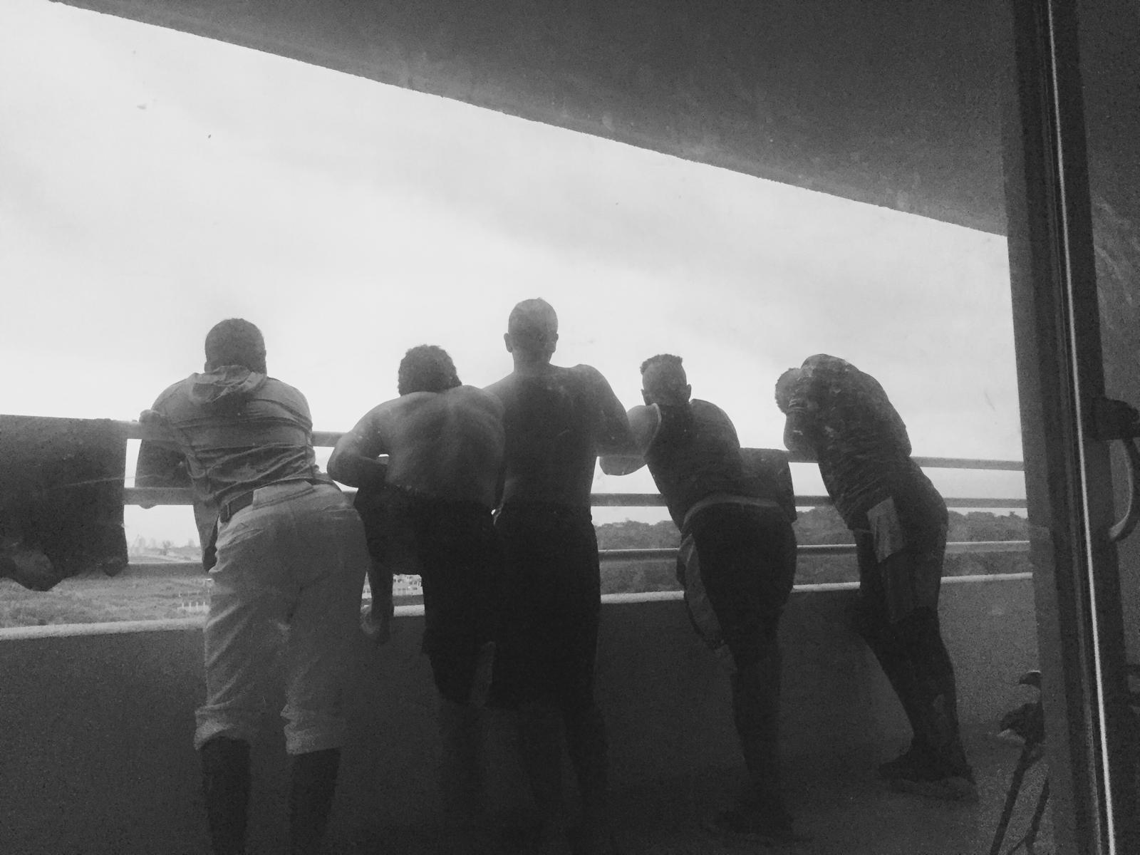 Players at the rail above the field in Panama